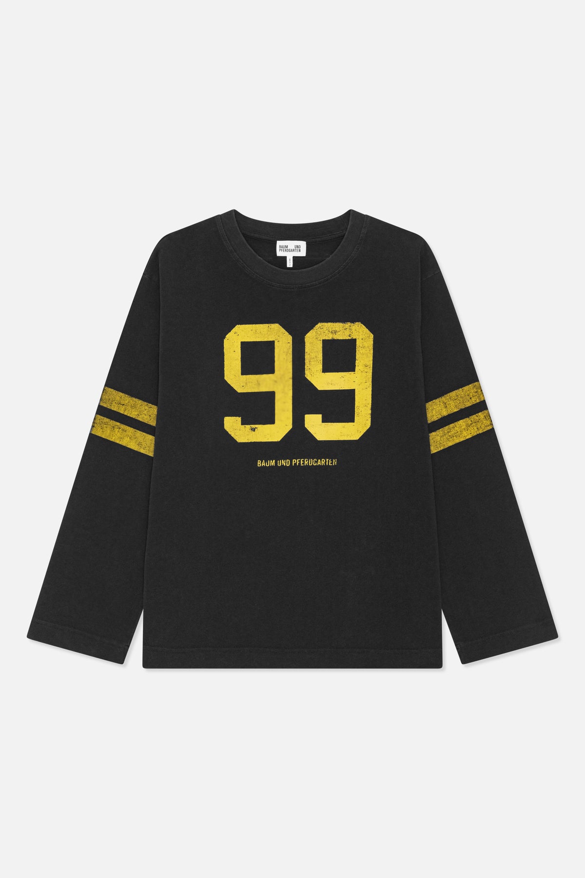 Framsida av en svart långärmad tröja med rund hals, slitet gult "99"-tryck och matchande ränder på ärmarna.